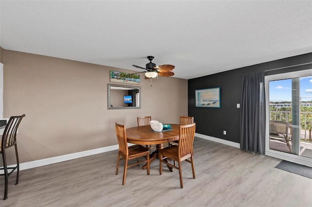 dining area with ceiling fan and light wood-type flooring