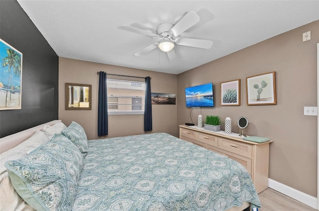 bedroom featuring ceiling fan and light wood-type flooring