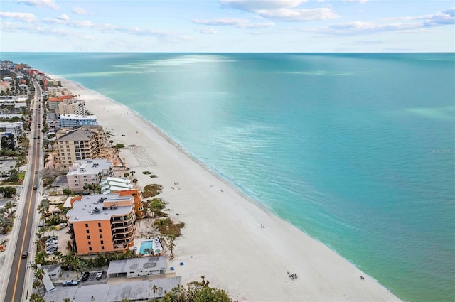 aerial view with a water view and a view of the beach