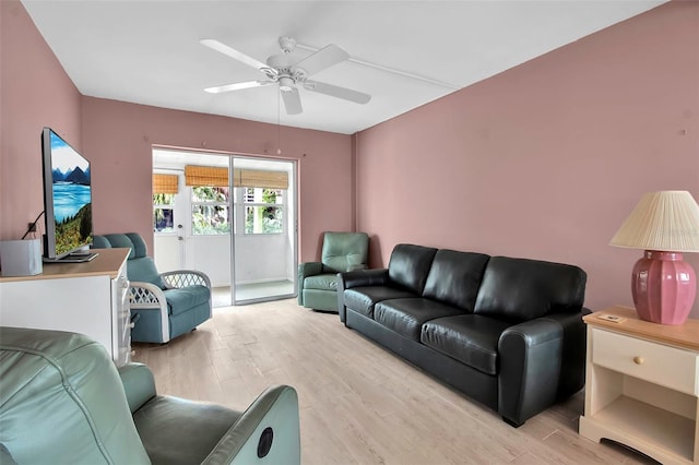 living room with ceiling fan and light hardwood / wood-style floors