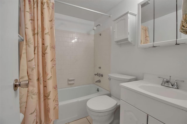 full bathroom featuring tile patterned flooring, shower / bath combo with shower curtain, vanity, and toilet