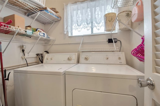 washroom with independent washer and dryer