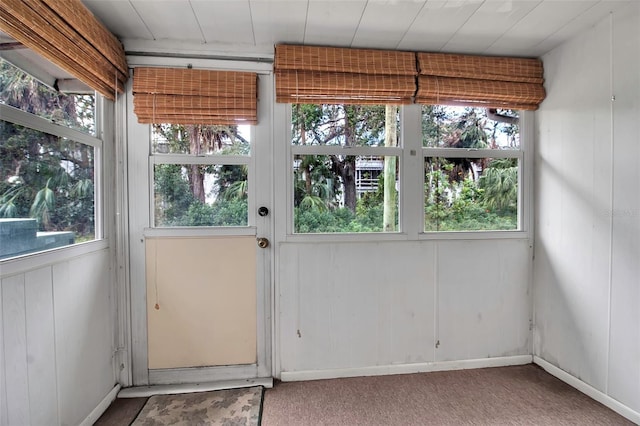 unfurnished sunroom featuring a wealth of natural light