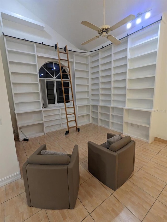 living room featuring tile patterned floors, ceiling fan, built in features, and lofted ceiling