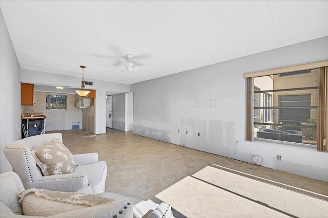 tiled living room with ceiling fan