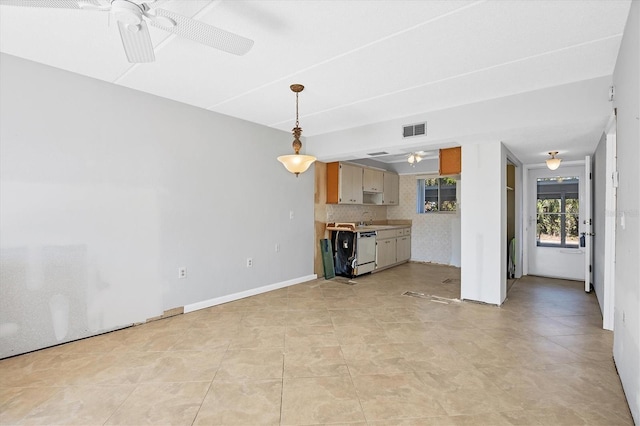 unfurnished living room featuring ceiling fan