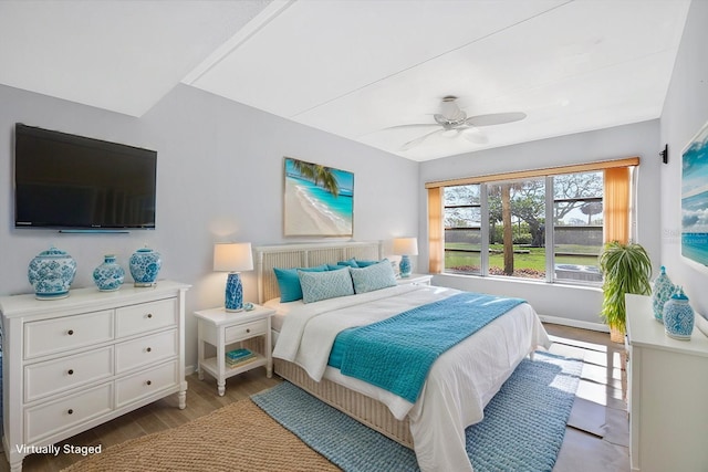 bedroom with ceiling fan and light wood-type flooring