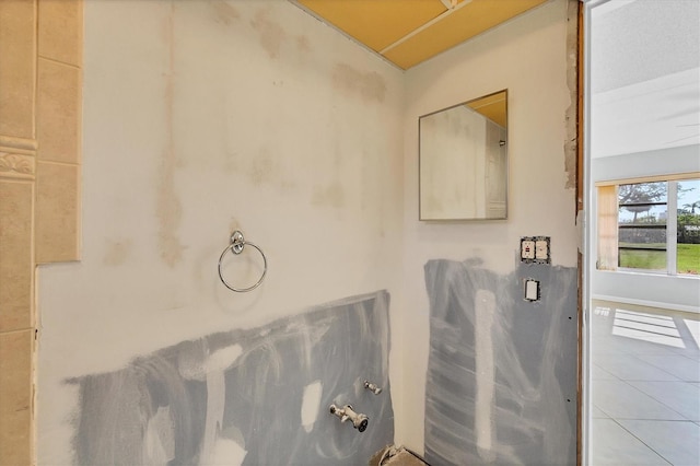 bathroom with tile patterned floors