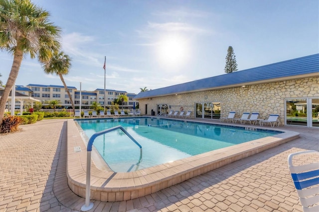 view of swimming pool with a patio area