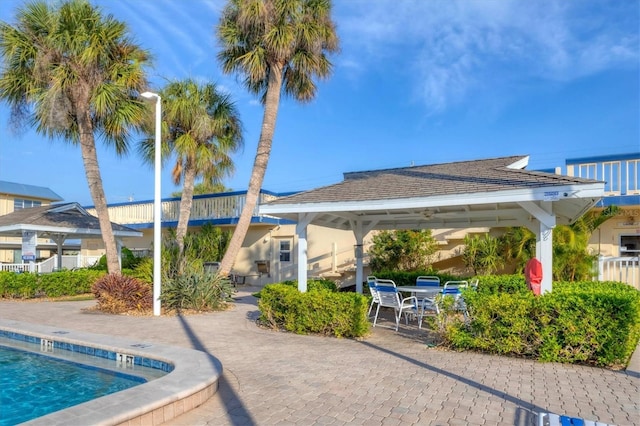 view of swimming pool featuring a gazebo and a patio