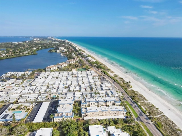 aerial view featuring a view of the beach and a water view