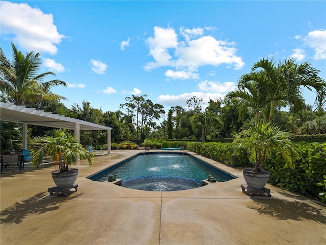 view of swimming pool featuring an in ground hot tub, pool water feature, and a patio area