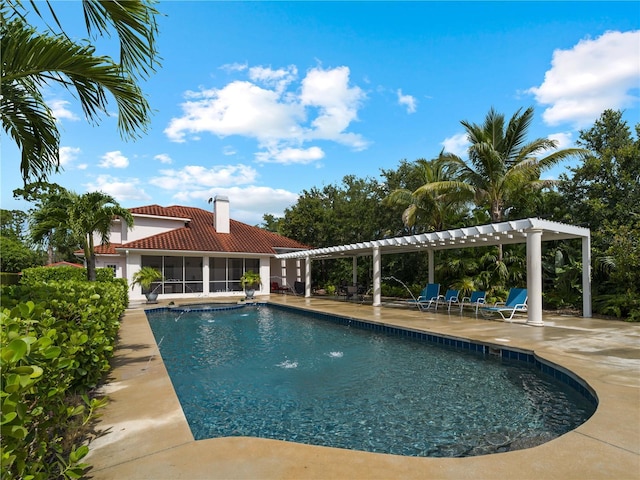 view of swimming pool featuring pool water feature and a patio area