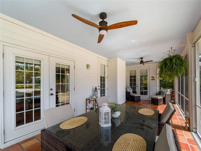 sunroom featuring french doors and ceiling fan