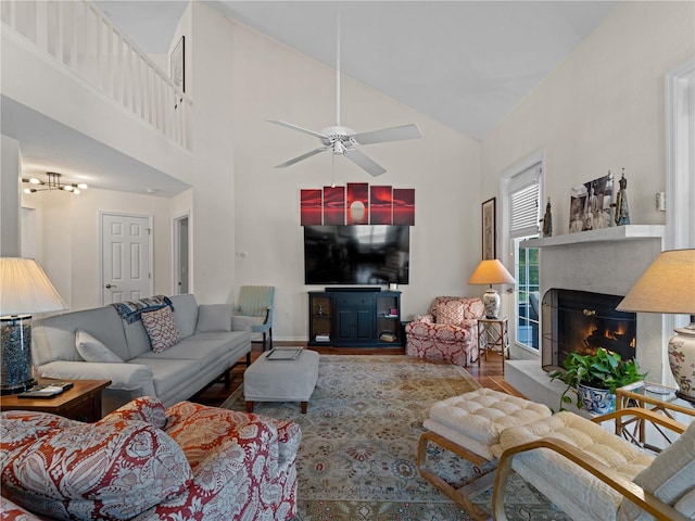 living room featuring ceiling fan, wood-type flooring, and high vaulted ceiling