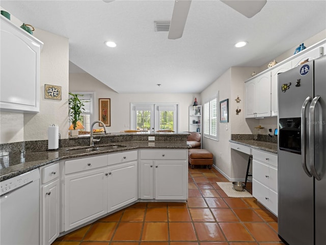 kitchen featuring white cabinetry, sink, stainless steel fridge with ice dispenser, kitchen peninsula, and white dishwasher