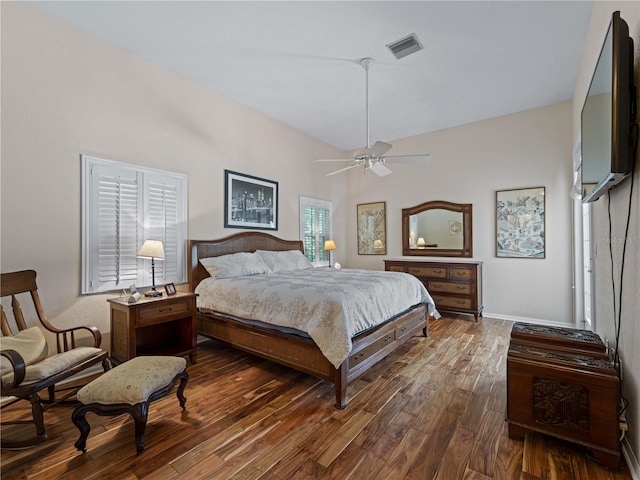 bedroom with ceiling fan and dark hardwood / wood-style flooring