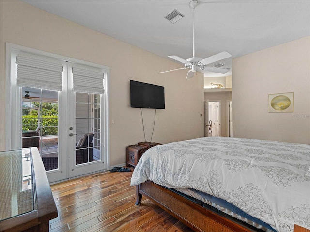 bedroom featuring access to exterior, hardwood / wood-style floors, and ceiling fan