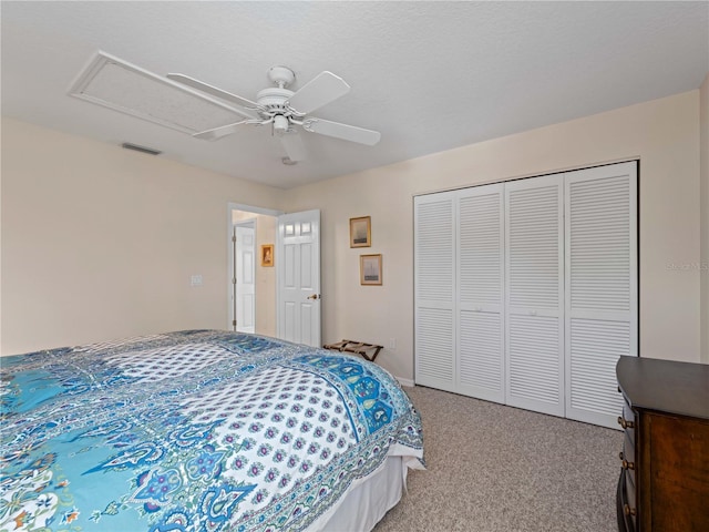 bedroom with light carpet, a closet, and ceiling fan