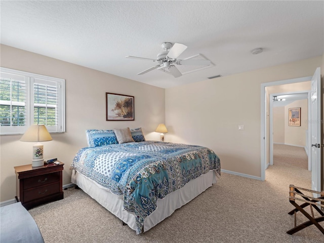 bedroom with ceiling fan and light colored carpet