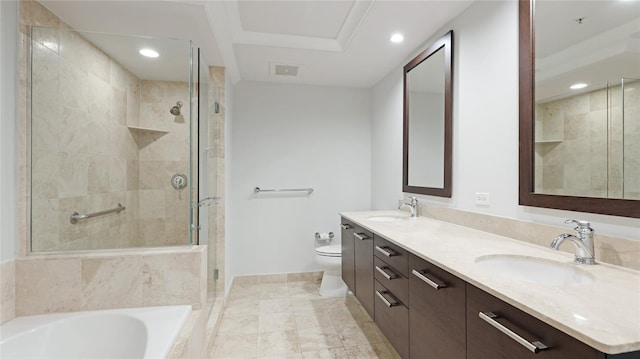 full bathroom featuring vanity, toilet, and separate shower and tub