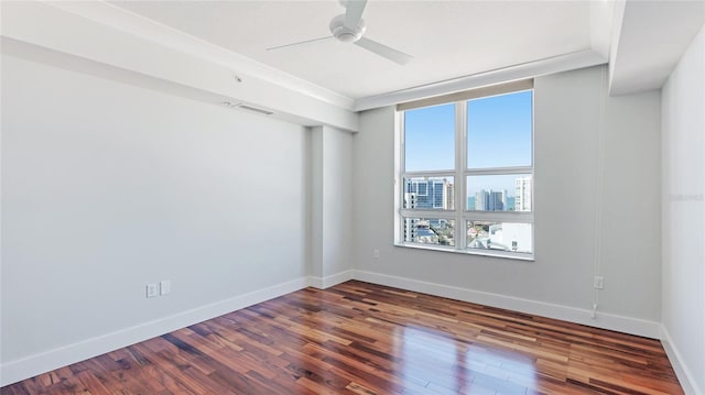 empty room featuring hardwood / wood-style floors and ceiling fan