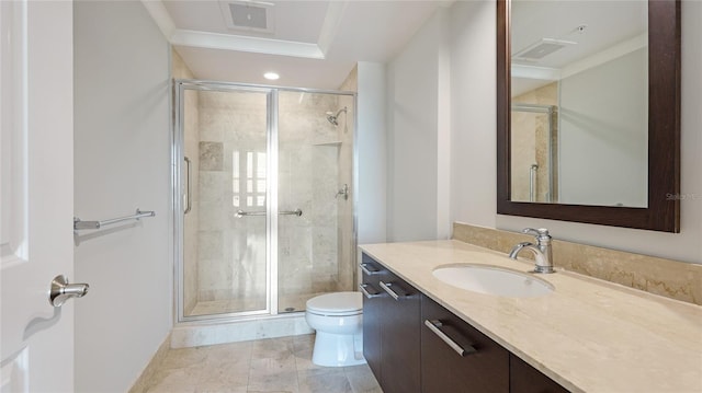 bathroom featuring vanity, a shower with door, and toilet