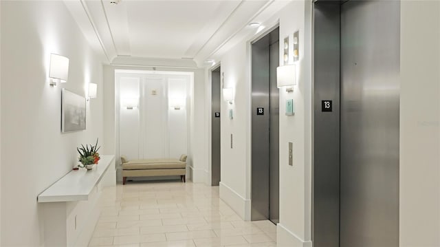 corridor with light tile patterned floors and elevator