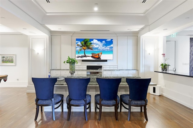 home theater room featuring hardwood / wood-style flooring