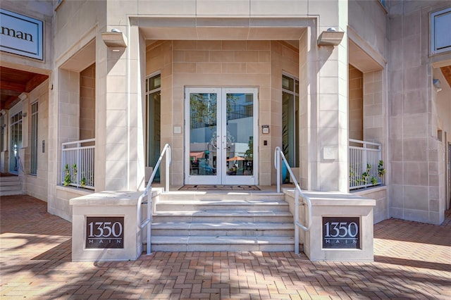 view of exterior entry featuring french doors