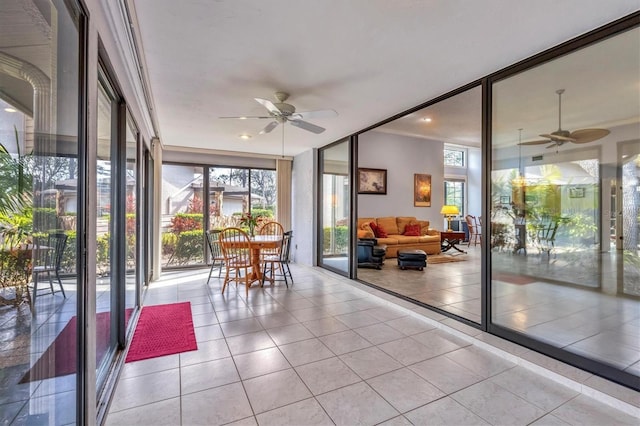 sunroom with ceiling fan and plenty of natural light