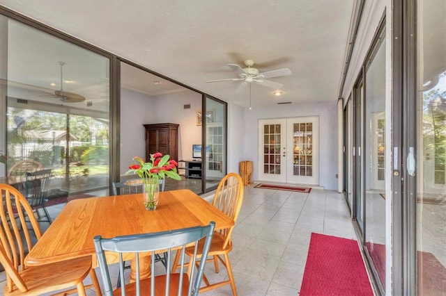 dining space featuring french doors, ceiling fan, and light tile patterned flooring