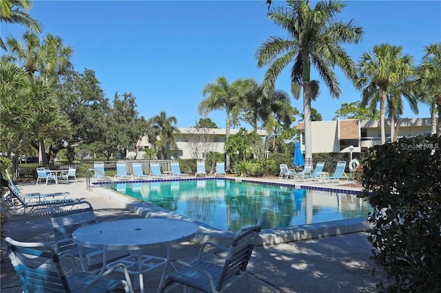 view of swimming pool with a patio