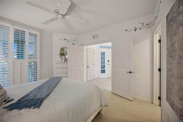 bedroom with light tile patterned floors and ceiling fan