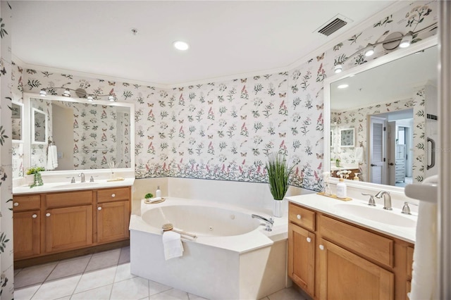 bathroom featuring tile patterned flooring, vanity, a bathing tub, and crown molding