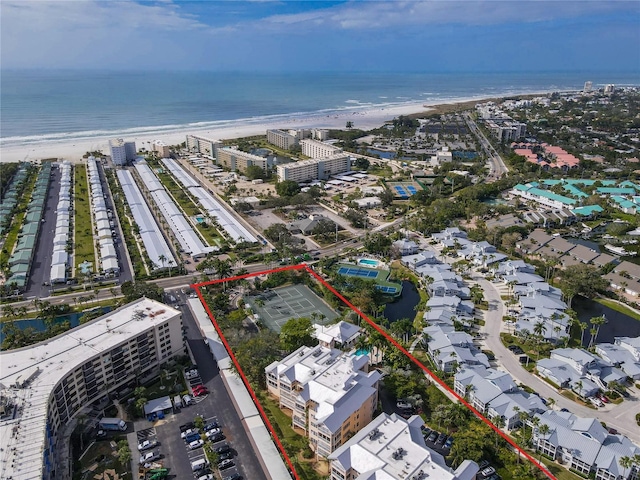 aerial view featuring a water view and a beach view