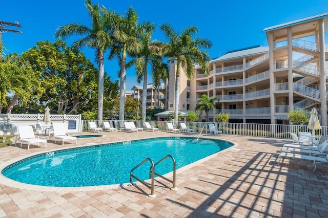 view of swimming pool featuring a patio area