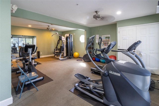 exercise room with carpet flooring and ceiling fan