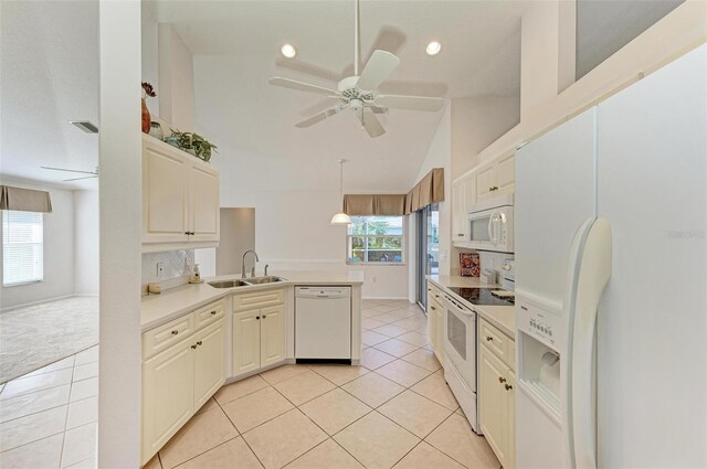 kitchen featuring white appliances, sink, ceiling fan, light tile patterned floors, and decorative light fixtures