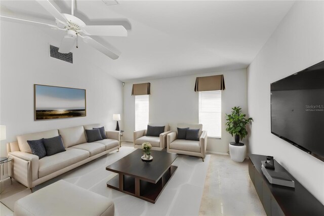 living room featuring ceiling fan and lofted ceiling