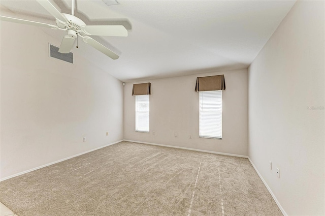 unfurnished room featuring light carpet and ceiling fan