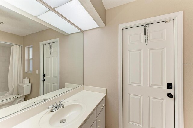 bathroom with vanity and toilet