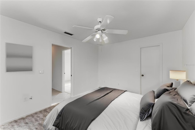 bedroom featuring light carpet and ceiling fan