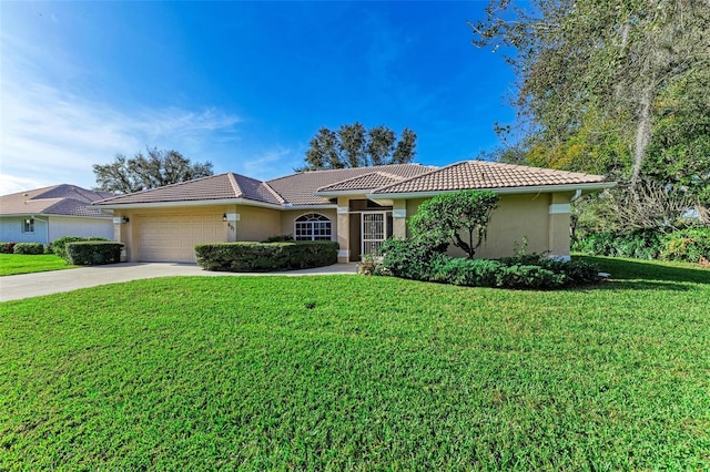 ranch-style home with a front yard and a garage