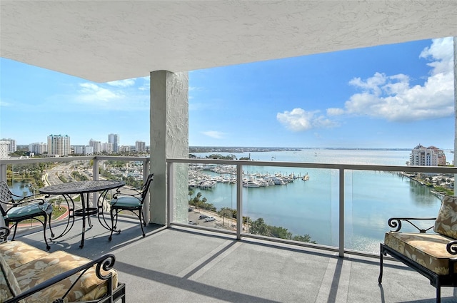 balcony featuring a water view