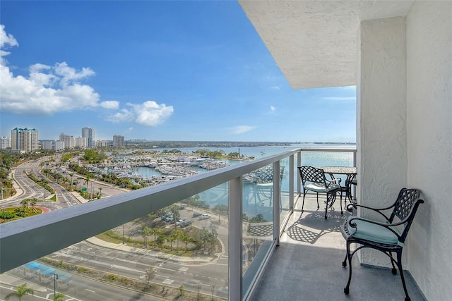 balcony featuring a water view