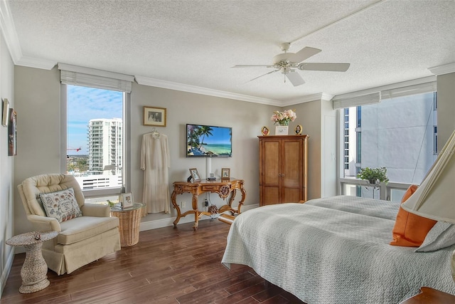 bedroom with multiple windows, ceiling fan, and crown molding