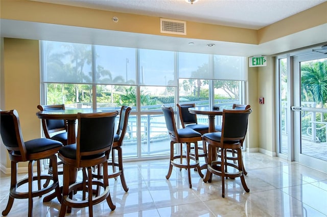 dining area with a textured ceiling