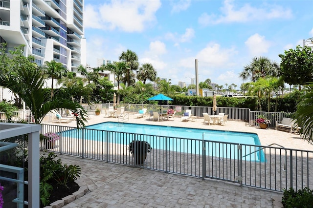 view of swimming pool featuring a patio area