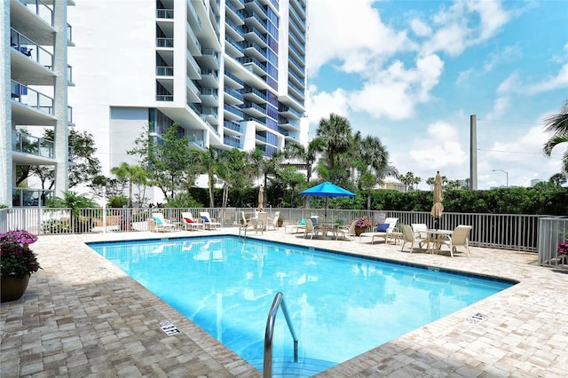 view of swimming pool with a patio